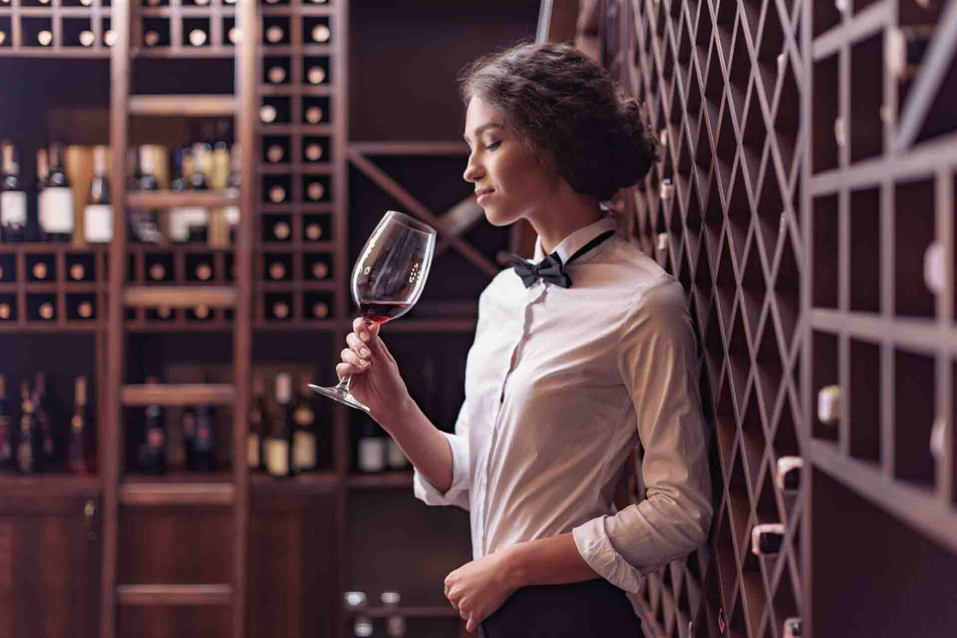 young-beautiful-woman-sommelier-tasting-red-wine-i-2022-11-02-04-14-11-utc